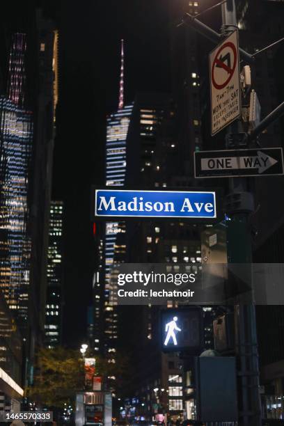 streets of manhattan, ny at night - madison avenue stock pictures, royalty-free photos & images