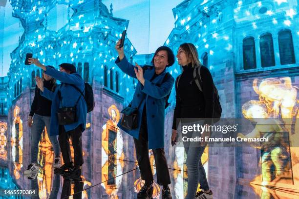 Two women take a selfie at the region Lombardy tourist board stand during BIT 2023 at Allianz MiCo on February 13, 2023 in Milan, Italy. BIT 2023,...