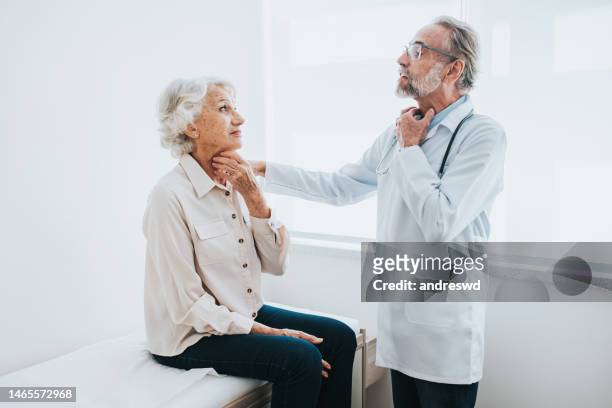 senior patient with sore throat, doctor consultation - throat exam stock pictures, royalty-free photos & images