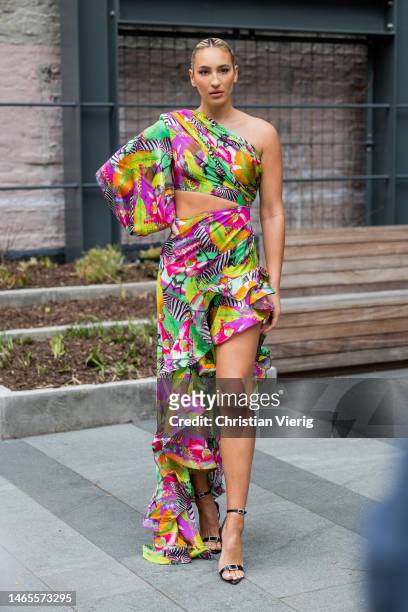 Alyssa Mills wears asymmetric skirt with floral print, top outside Bronx & Banco during New York Fashion Week on February 12, 2023 in New York City.