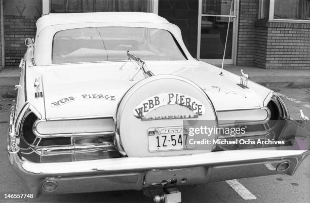 The 1962 Pontiac Bonneville convertible belonging to country music star Webb Pierce and customized by Nudie Cohn parked outside the offices and...