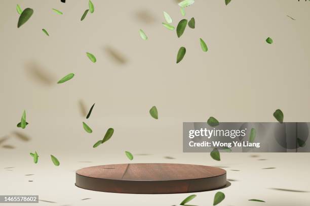 wood podium with leaf falling down, 3d render - leaf blowing stock pictures, royalty-free photos & images