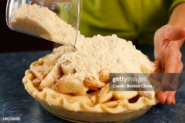 Verrill Farm's fourth step for apple pie: add crumble topping.