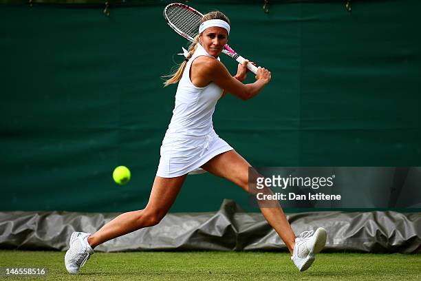 Gisela Dulko of Argentina plays a backhand during the ladies' qualifying singles first round match against Samantha Murray of Great Britain on day...