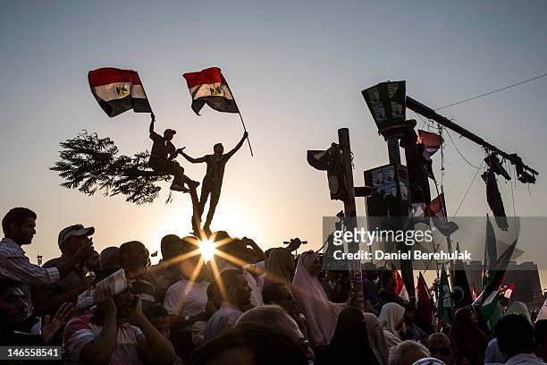 Egyptians supporters of the Muslim Brotherhood celebrate a premature victory for their presidential candidate Mohamed Morsi in Tahrir Square on June...