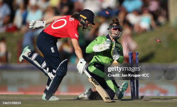 Amy Jones of England dives to make their ground as Mary Waldron of Ireland removes the bails during the ICC Women's T20 World Cup group B match...