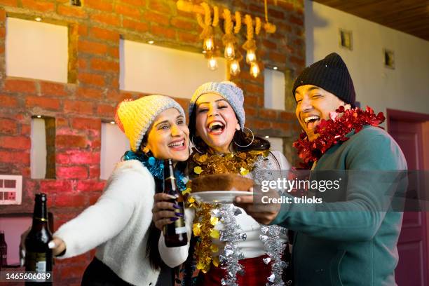 ecstatic group of friends celebrating party - happy new year celebration in india stock pictures, royalty-free photos & images