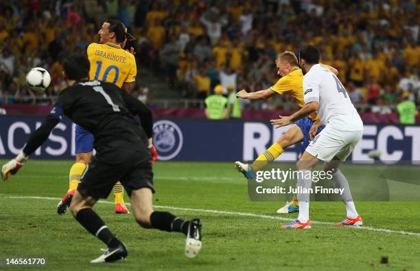 Sebastian Larsson of Sweden scores his teams second goal during the UEFA EURO 2012 group D match between Sweden and France at The Olympic Stadium on...