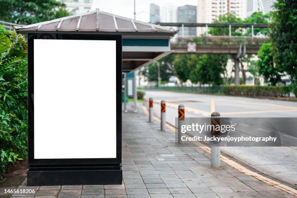 bus and tram station with advertising billboard screen - billboard bus stock pictures, royalty-free photos & images