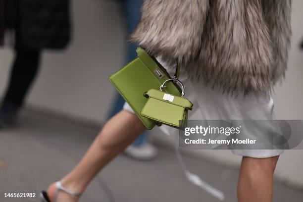 Mary Leest seen wearing white silk suit shorts, brown fake fur oversized coat, Fendi Peekaboo lime green shiny leather handbag, silver shiny leather...