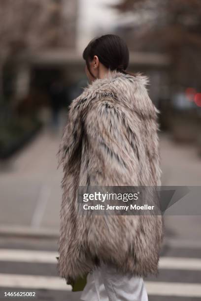 Mary Leest seen wearing diamonds earrings, white silk suit shorts, brown fake fur oversized coat, outside Jason Wu Collection, during New York...