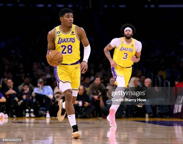 Rui Hachimura of the Los Angeles Lakers dribbles in front of Anthony Davis during the game against the Milwaukee Bucks at Crypto.com Arena on...