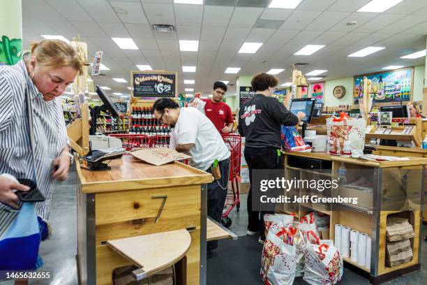 Miami Beach, Florida, Trader Joe's grocery store customer at check out counter with cashier.