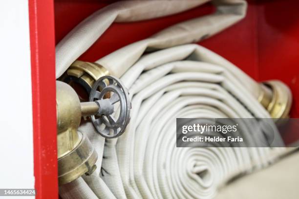 hydrant box with fire hose coiled inside it - fire hose stock pictures, royalty-free photos & images