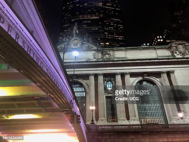 Pershing Square Plaza bridge to Grand Central Terminal at night with MetLife building behind, Manhattan, New York.