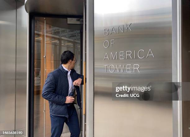 Man entering Bank of America Tower on 42nd street, Manhattan, New York.