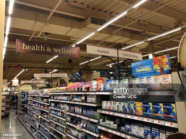 Health and Wellness aisle, stomach, cold and allergy over the counter medication at Wegmans grocery store, Boston, Massachusetts.