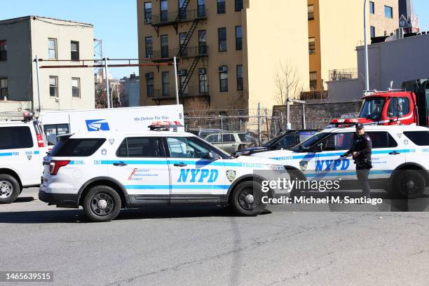 Officers stand guard as a search of crashed U-Haul truck is conducted on Hamilton Avenue on February 13, 2023 in the Red Hook neighborhood of the...