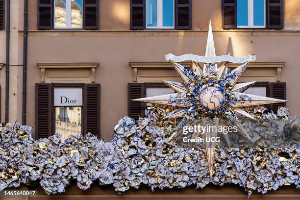 Dior storefront in Piazza di Spagna, Spanish Steps, front shop. Fashion boutique. Luxurious shopping. Christmas decorations. Rome, Italy, Europe, EU..