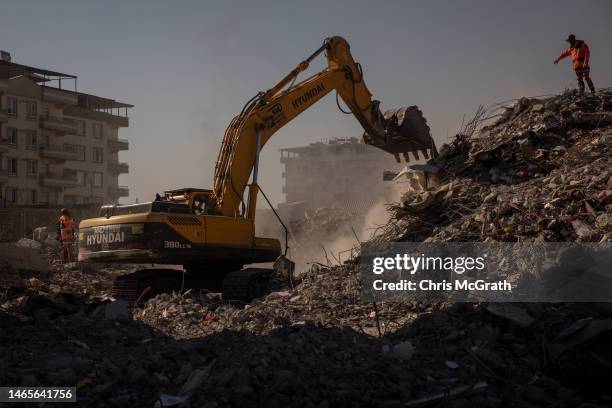 Rescue teams search a destroyed building on February 13, 2023 in Nurdagi, Turkey. A 7.8-magnitude earthquake hit near Gaziantep, Turkey, in the early...