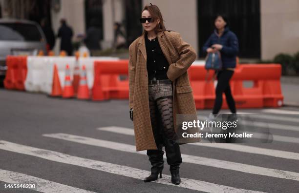 Guest wears Celine black square sunglasses, Miu Miu gold earrings, black tweed with gold buttoned jacket, yellow with brown / black houndstooth print...