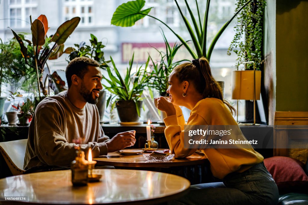 Couple on a weekend date at cute cafe