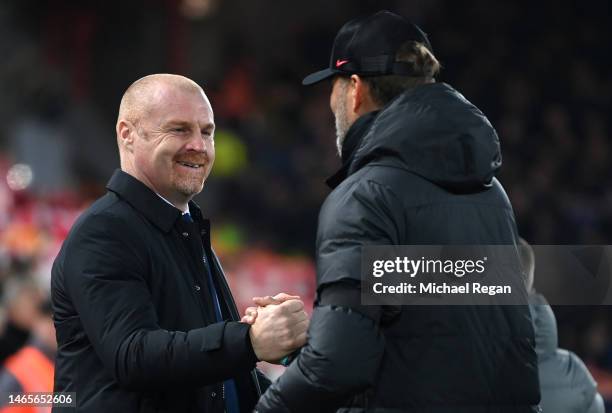 Juergen Klopp, Manager of Liverpool, greets Sean Dyche, Manager of Everton prior to the Premier League match between Liverpool FC and Everton FC at...