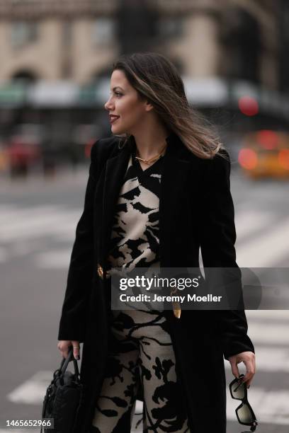 Lenia Perez wearing black / white patterned Vipop Set, gold VIPOP Necklace, gold Brazalete VIPOP, black velvet Schiaparelli jacket during the New...