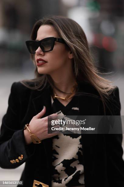 Lenia Perez wearing black shades, black / white patterned Vipop Set, gold VIPOP Necklace, gold Brazalete VIPOP, black velvet Schiaparelli jacket...