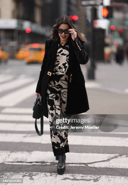 Lenia Perez wearing black shades, black / white patterned Vipop Set, gold VIPOP Necklace, gold Brazalete VIPOP, black small Dior bag, black velvet...