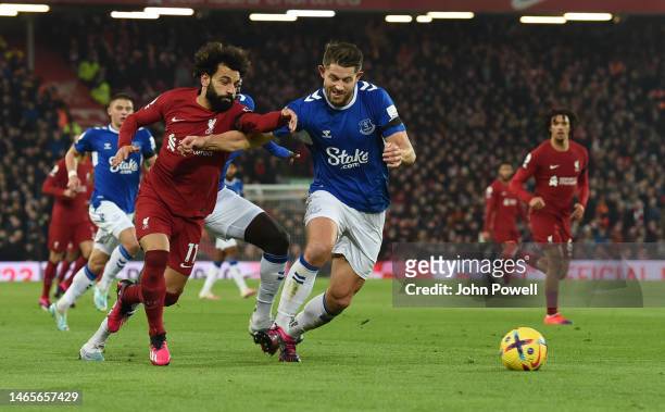 Mohamed Salah of Liverpool with Everton's James Tarkowski during the Premier League match between Liverpool FC and Everton FC at Anfield on February...