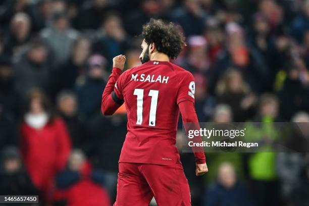 Mohamed Salah of Liverpool celebrates after scoring the team's first goal during the Premier League match between Liverpool FC and Everton FC at...