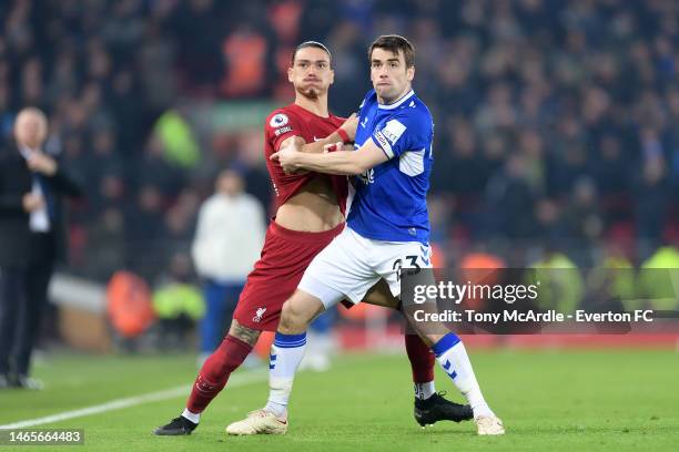 Seamus Coleman of Everton and Daerwin Nunez challenge for the ball during the Premier League match between Liverpool FC and Everton FC at Anfield on...