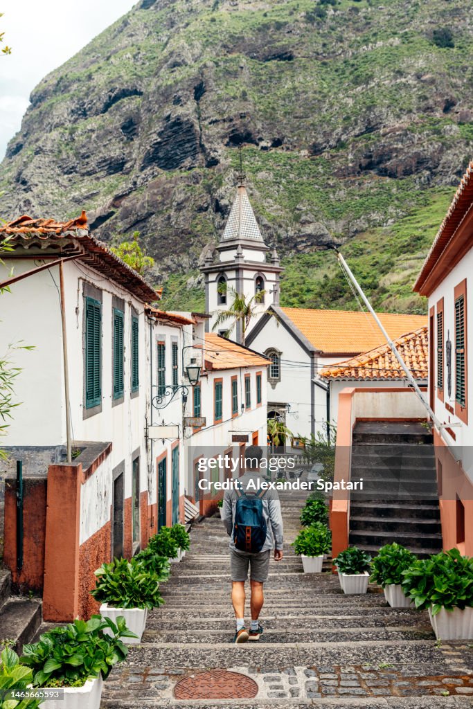 Tourist Exploring Sao Vicente Village On Madeira Island Portugal High tourist-exploring-sao-vicente-village-on-madeira-island-portugal-high