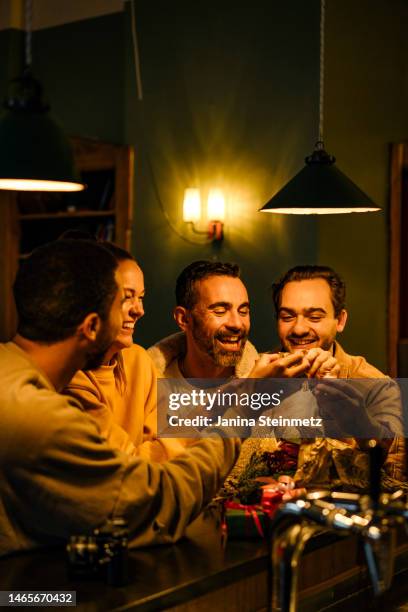 group of friends making toast with shot glasses - 40 birthday foto e immagini stock