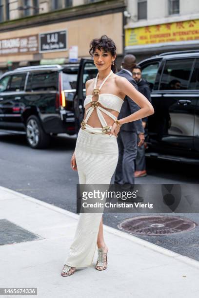 Lexy Panterra wears white cut out dress outside Bronx & Banco during New York Fashion Week on February 12, 2023 in New York City.