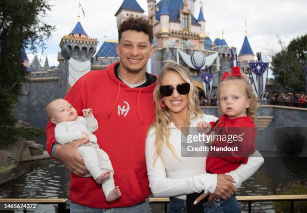 In this handout image provided by Disney, Patrick Mahomes of the Kansas City Chiefs and Brittney Mahomes pose with their children, Sterling and...