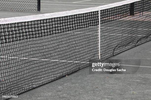 tennis game net - tennis ball on court stock pictures, royalty-free photos & images
