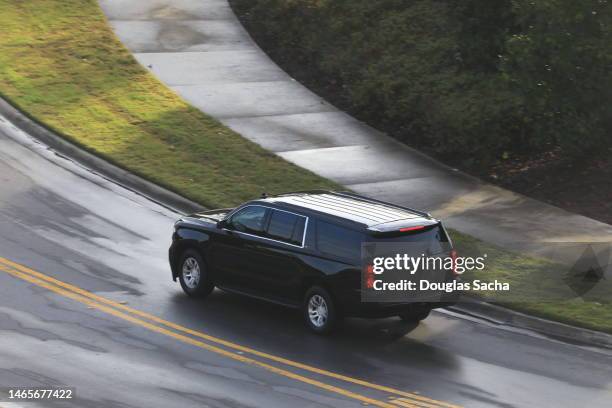 dark colored suv vehicle on the road - suv fotografías e imágenes de stock