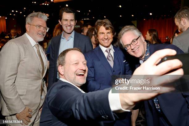 Christopher McQuarrie, Joseph Kosinski, guest, Tom Cruise, and Eddie Hamilton attend the 95th Annual Oscars Nominees Luncheon at The Beverly Hilton...