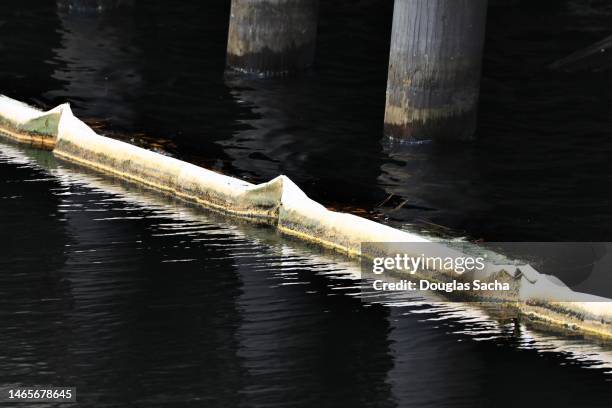 chemical spill cleanup and containment boom - hydrocarbon stock pictures, royalty-free photos & images