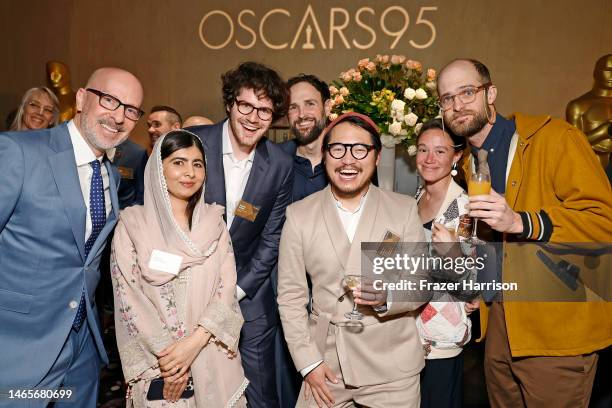 Joshua Seftel, Malala Yousafzai, Daniel Rohr, Shane Boris, Daniel Kwan, guest, and Daniel Scheinert attend the 95th Annual Oscars Nominees Luncheon...