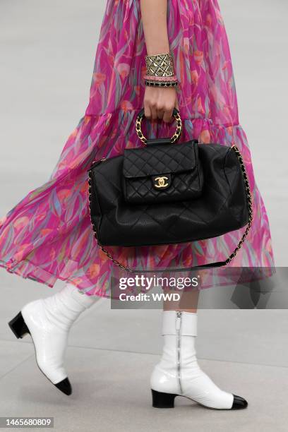 Model on the catwalk, bag detail