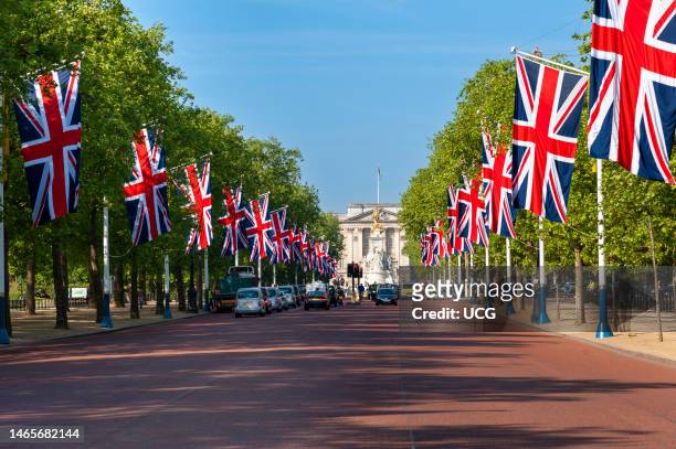 Union Jack flags lining the Mall towards Buckingham Palace for state occasion, London, UK.