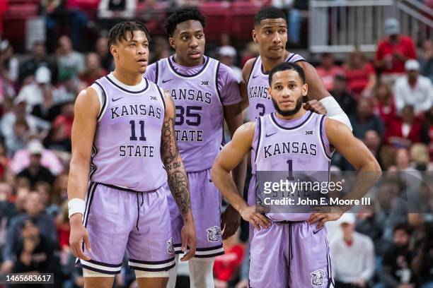 Keyontae Johnson, Nae'Qwan Tomlin, David N'Guessan, and Markquis Nowell of the Kansas State Wildcats stand on the court during the first half of the...