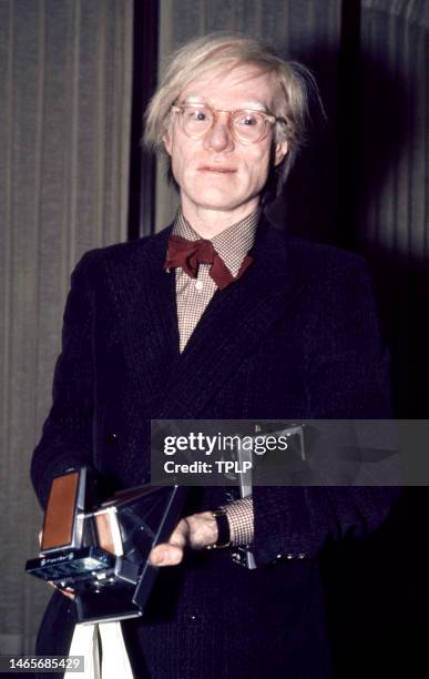 American visual artist, film director, and producer Andy Warhol poses for a portrait at an event in New York, New York, circa 1980.