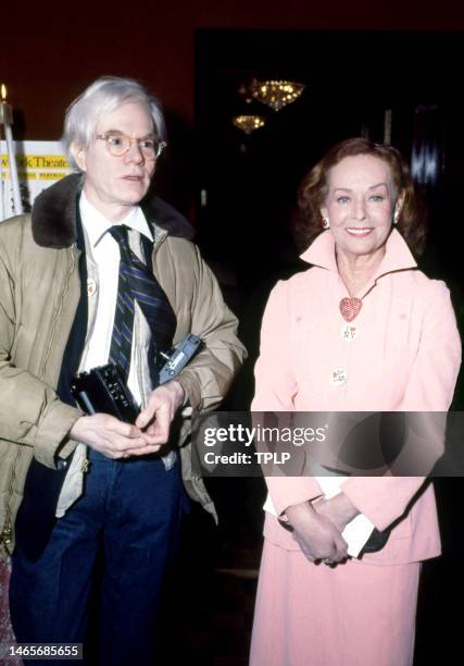 American visual artist, film director, and producer Andy Warhol and American actress Paulette Goddard attend a party at Tavern on the Green in New...