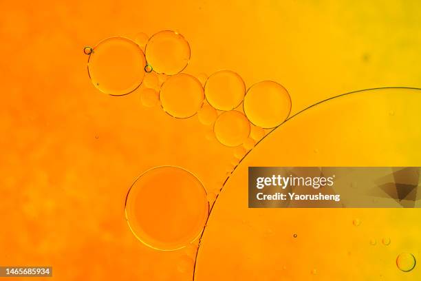 golden oil bubbles - 潤滑油 ストックフォトと画像