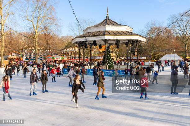 Open air ice skating rink at Christmas at Winter Wonderland, Hyde Park, London, England, UK.