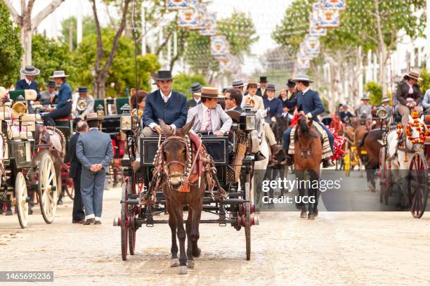 Men riding horses during the Seville April Fair, Andalusia, Spain.